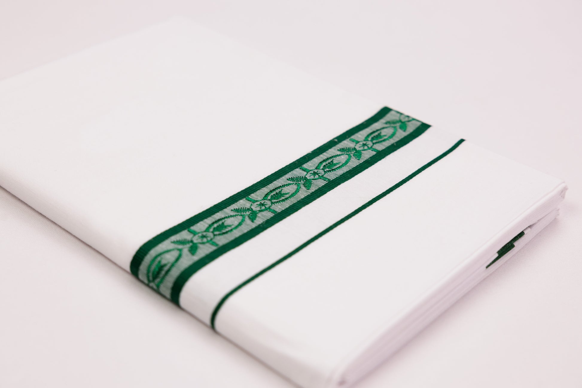 BUY FANCY DESIGN GREEN BORDER WHITE SINGLE DHOTI 