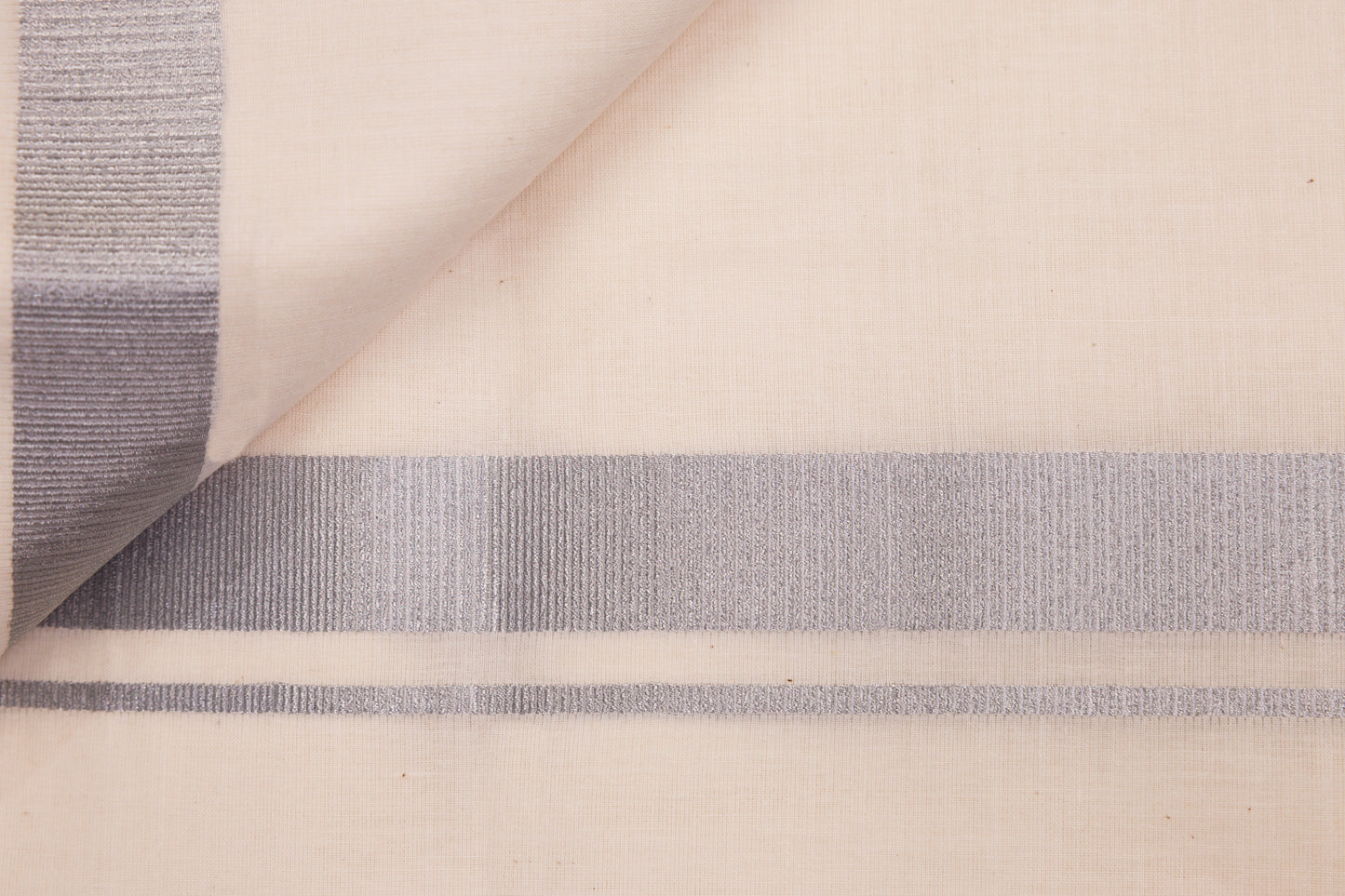 Cream double dhothie for men with silver jari border in 1 inch design, perfect for traditional wear.