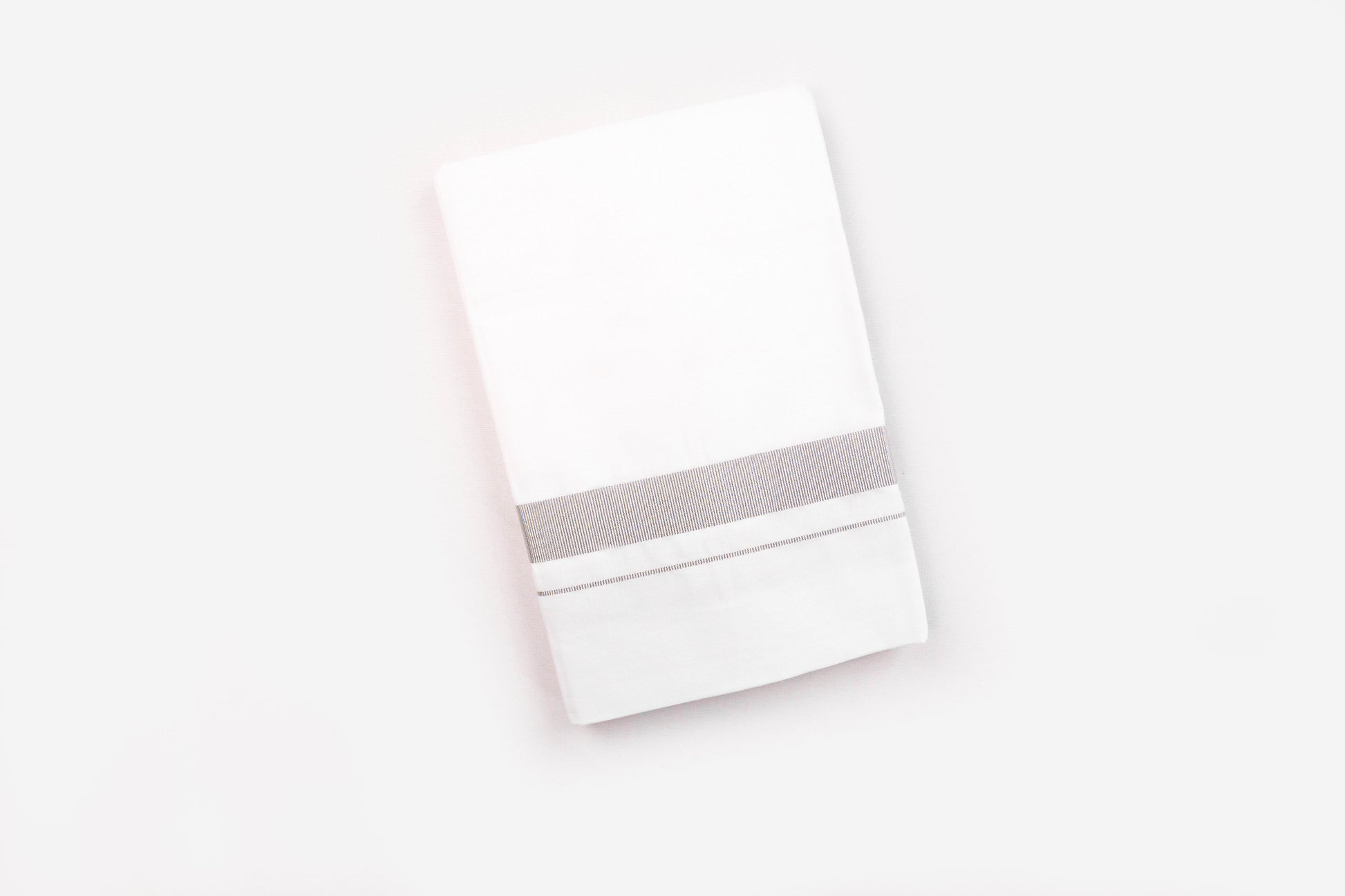 1 inch silver jari border dhothie for men in white fabric with elegant silver detailing